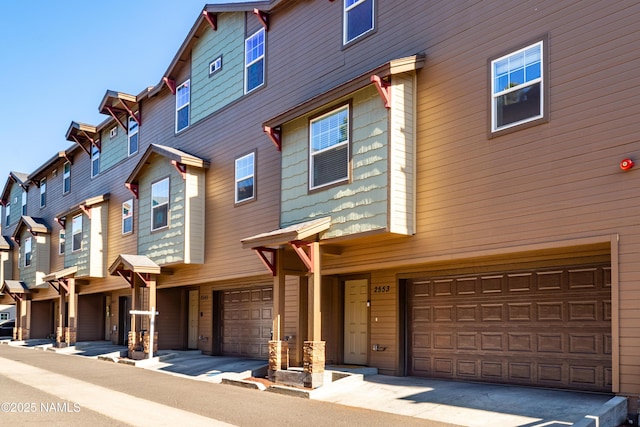 2553 W Cripple Creek Dr, Flagstaff, AZ 86001 - multi unit property featuring an attached garage and a residential view