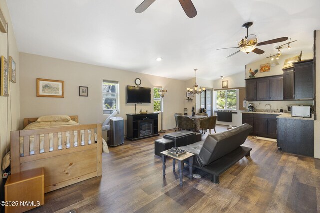 655 E Trout Creek Rd, Munds Park, AZ 86017 - living room featuring a ceiling fan, plenty of natural light, dark wood-style flooring, a chandelier, and lofted ceiling