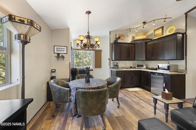 655 E Trout Creek Rd, Munds Park, AZ 86017 - dining space with light wood-type flooring and a chandelier