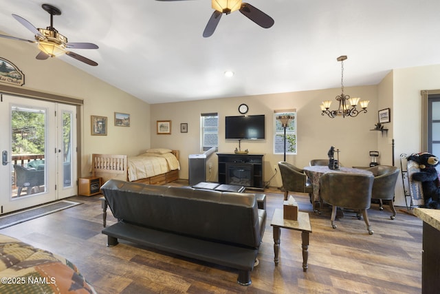 655 E Trout Creek Rd, Munds Park, AZ 86017 - living area with a ceiling fan, lofted ceiling, wood finished floors, plenty of natural light, and a chandelier
