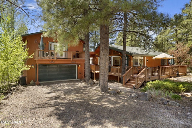 655 E Trout Creek Rd, Munds Park, AZ 86017 - view of front facade featuring a garage, driveway, and a deck