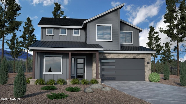 contemporary house featuring a garage, a standing seam roof, stone siding, and board and batten siding