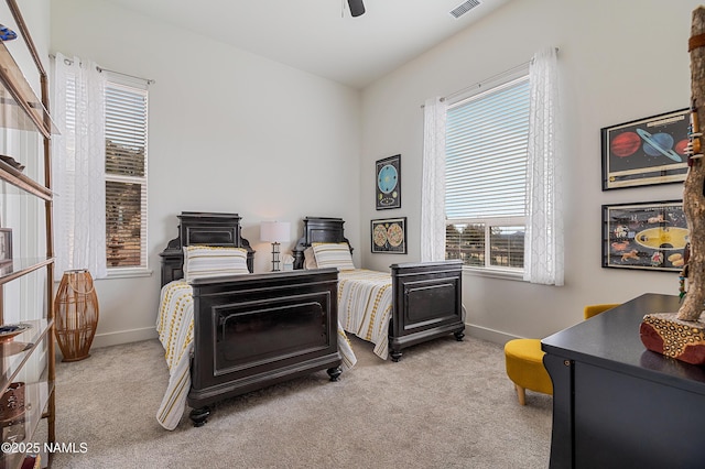 carpeted bedroom featuring ceiling fan