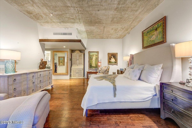 bedroom featuring visible vents and hardwood / wood-style flooring