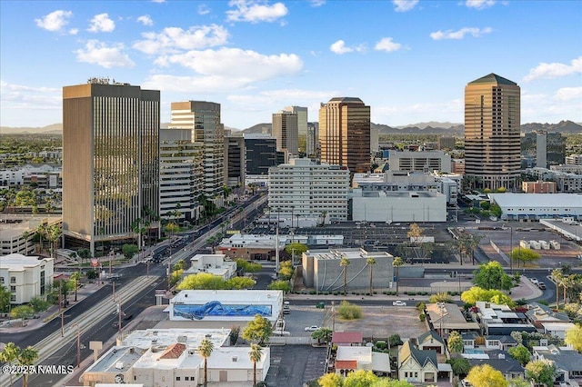 property's view of city featuring a mountain view