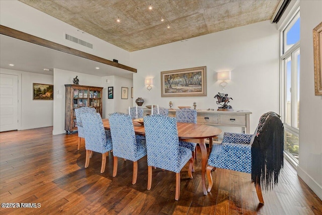 dining space with visible vents and hardwood / wood-style floors