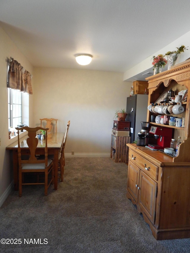 1000 N Beaver St Unit 116, Flagstaff, AZ 86001 - dining area with baseboards and carpet