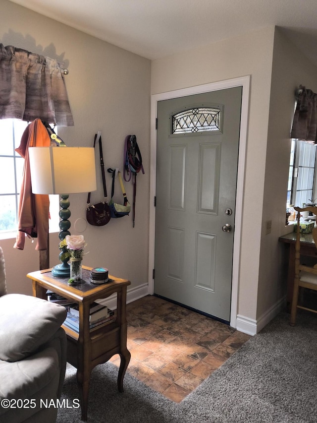 1000 N Beaver St Unit 116, Flagstaff, AZ 86001 - entrance foyer with baseboards and stone finish floor