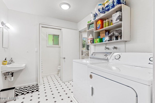 washroom featuring sink and washing machine and dryer