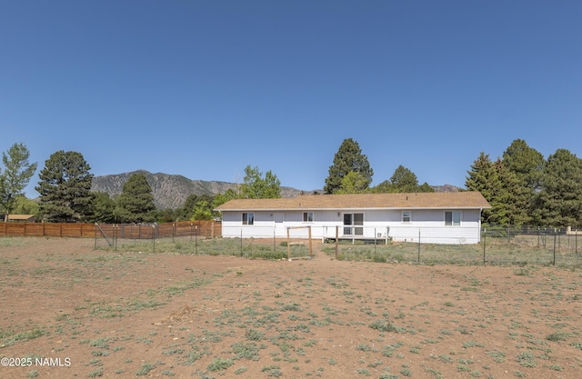 7815 Prairie Dog Ln, Flagstaff, AZ 86004 - rear view of house featuring a mountain view