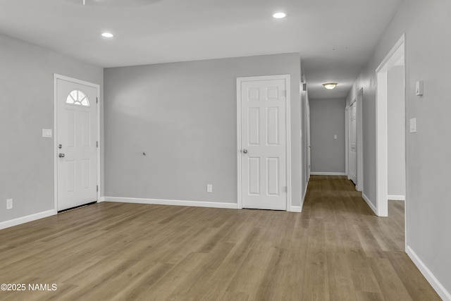 7815 Prairie Dog Ln, Flagstaff, AZ 86004 - entrance foyer with light wood finished floors, baseboards, and recessed lighting