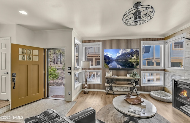 3001 E Butler Ave Unit 21, Flagstaff, AZ 86004 - foyer featuring wood finished floors, crown molding, recessed lighting, and a glass covered fireplace