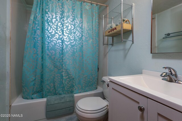 bathroom featuring toilet, shower / tub combo, and vanity