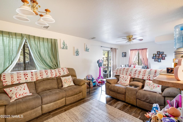 4551 E Allison Dr, Flagstaff, AZ 86004 - living room featuring dark hardwood / wood-style floors, a textured ceiling, and ceiling fan