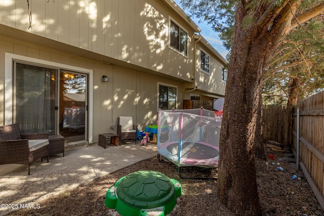 4551 E Allison Dr, Flagstaff, AZ 86004 - back of property with a trampoline and a patio