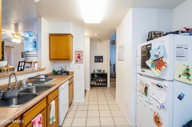 4551 E Allison Dr, Flagstaff, AZ 86004 - kitchen featuring ceiling fan, white appliances, sink, and light tile patterned floors