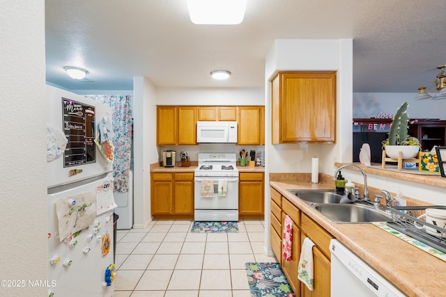 4551 E Allison Dr, Flagstaff, AZ 86004 - kitchen with white appliances, sink, a textured ceiling, and light tile patterned floors