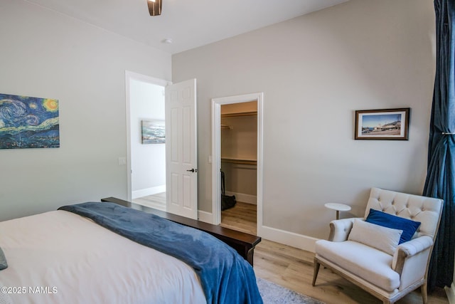 3605 N Langdale Trl, Flagstaff, AZ 86001 - bedroom featuring wood finished floors, a spacious closet, and baseboards