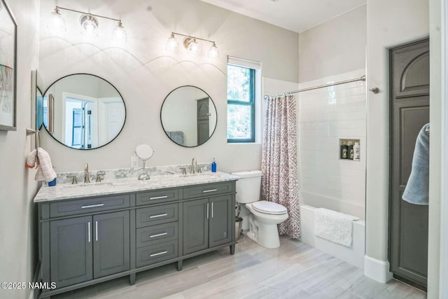 3605 N Langdale Trl, Flagstaff, AZ 86001 - full bath featuring toilet, double vanity, shower / bath combo with shower curtain, and wood finished floors