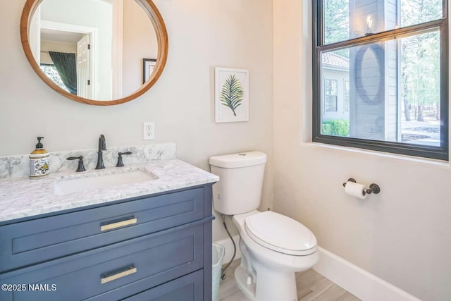3605 N Langdale Trl, Flagstaff, AZ 86001 - bathroom featuring toilet, vanity, and baseboards