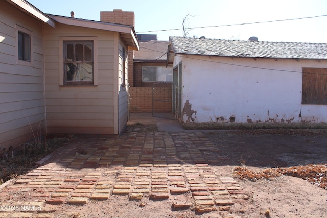 view of side of property featuring a patio