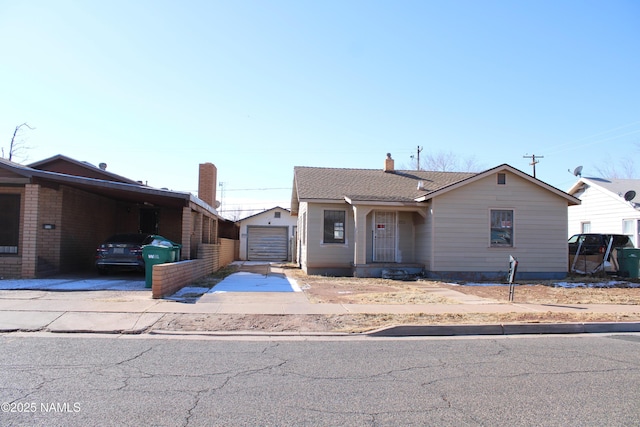 view of front of house featuring a carport and a garage