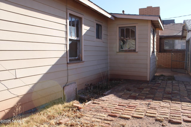 view of side of home featuring a patio