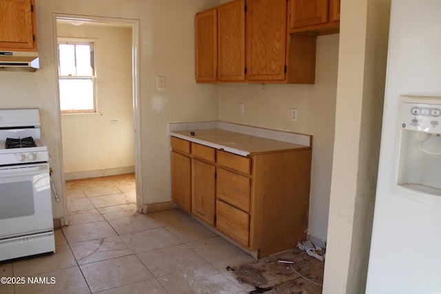 kitchen with white range with gas cooktop