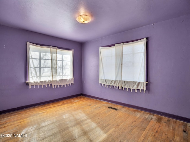 spare room featuring light wood-type flooring