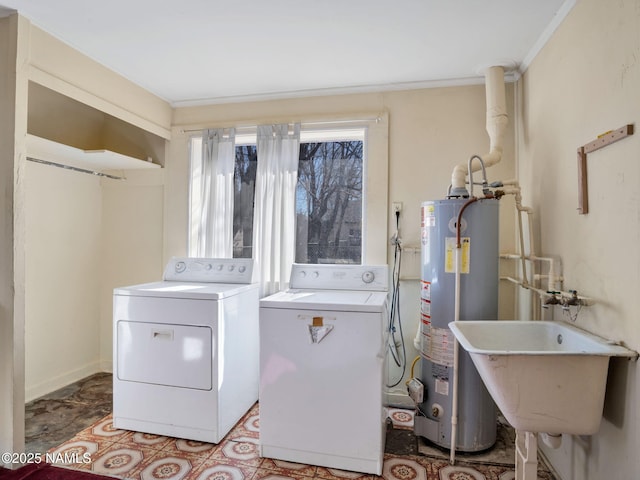 laundry room featuring water heater, sink, and independent washer and dryer
