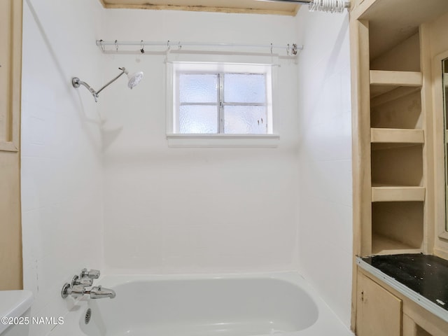 bathroom featuring shower / tub combination and vanity