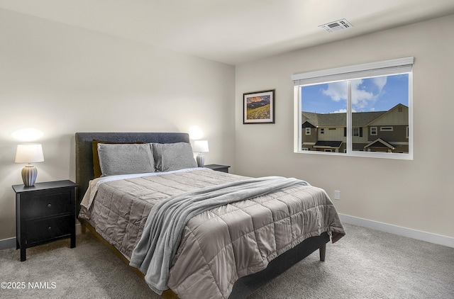 bedroom featuring baseboards, visible vents, and carpet flooring