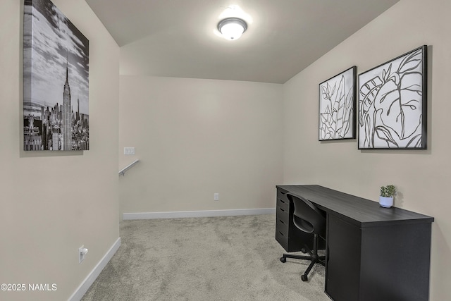 carpeted home office featuring baseboards