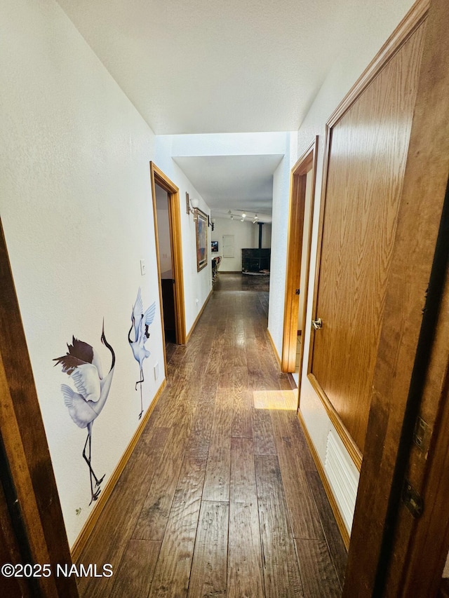 5070 N Weatherford Rd, Flagstaff, AZ 86001 - hall featuring dark wood-type flooring and baseboards