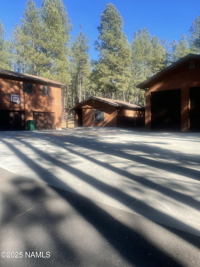 5070 N Weatherford Rd, Flagstaff, AZ 86001 - view of home's exterior featuring an outdoor structure and a garage