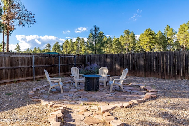 view of patio / terrace featuring a fire pit