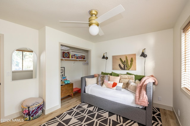 interior space featuring wood-type flooring and ceiling fan