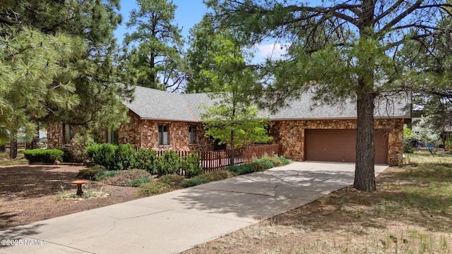 2468 N Strawberry Way, Flagstaff, AZ 86004 - view of front of home featuring stone siding, driveway, and roof with shingles