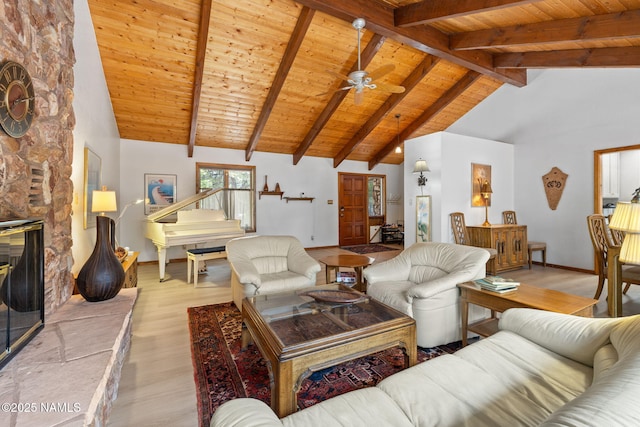 2468 N Strawberry Way, Flagstaff, AZ 86004 - living area featuring baseboards, wood finished floors, wood ceiling with exposed beams, a ceiling fan, and high vaulted ceiling