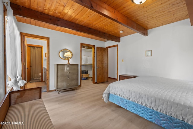 2468 N Strawberry Way, Flagstaff, AZ 86004 - bedroom with light wood-style floors, baseboards, wood ceiling with exposed beams, and ensuite bathroom