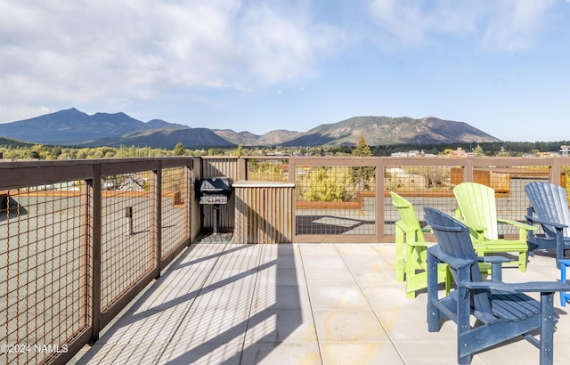 view of patio / terrace with a mountain view and grilling area