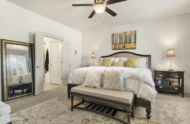 bedroom featuring a ceiling fan and carpet