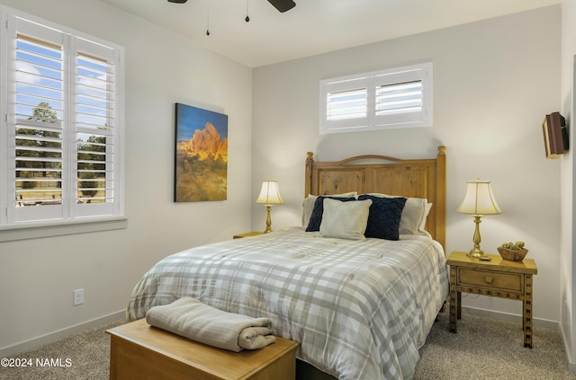 bedroom featuring baseboards, a ceiling fan, and carpet floors