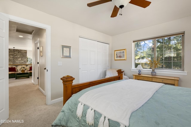 carpeted bedroom with a closet and ceiling fan