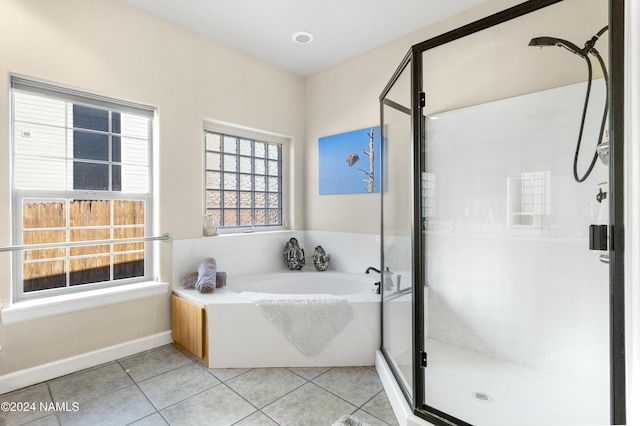 bathroom featuring shower with separate bathtub and tile patterned floors