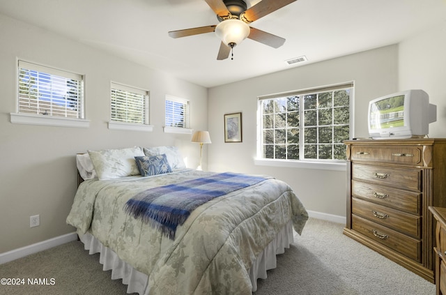 carpeted bedroom featuring ceiling fan