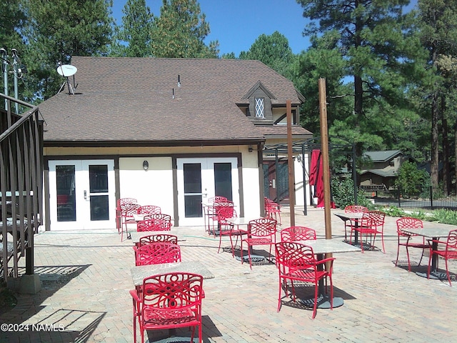 back of house featuring french doors and a patio