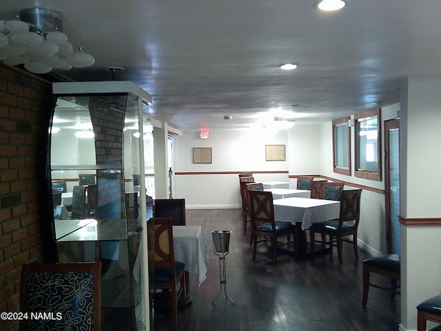 dining area featuring dark wood-type flooring