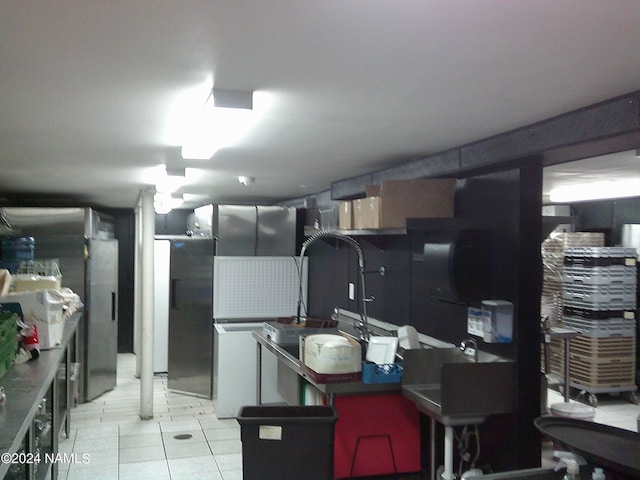 kitchen with stainless steel refrigerator and light tile patterned flooring