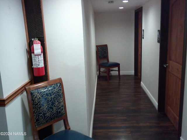 corridor featuring dark hardwood / wood-style floors